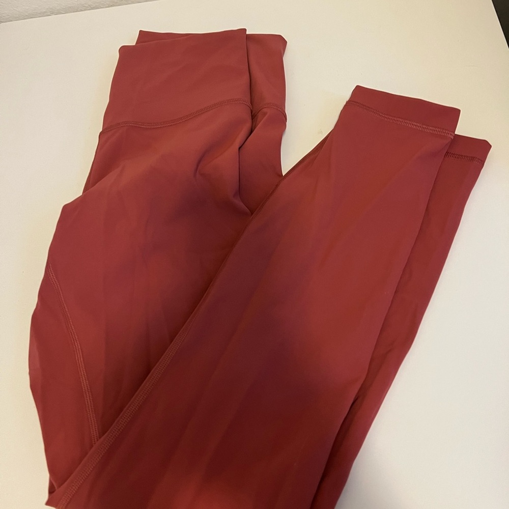 Never worn pink lululemon leggings size 6 7/8 inch